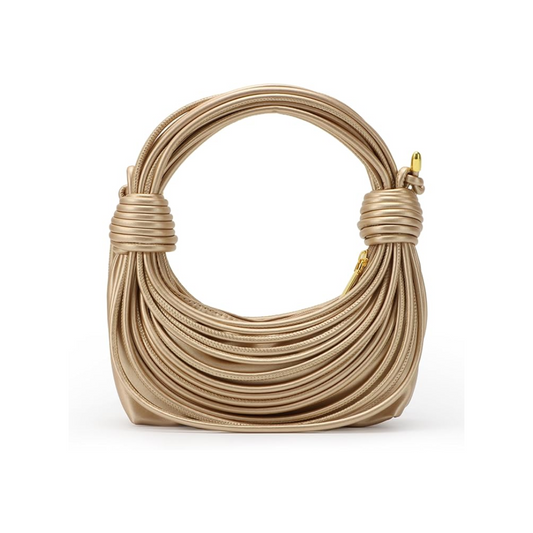 Bold curves, knotted handles, and major energy. The Tubular Bag is here to make moves.