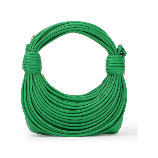 Bold curves, knotted handles, and major energy. The Tubular Bag is here to make moves.